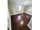 This bedroom has dark wood floors and light green walls at 16603 Nc Hwy 73 Hwy, Albemarle, NC 28001