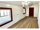 Bright bedroom featuring modern vinyl flooring, neutral walls, and contrasting dark trim on doors and windows at 16603 Nc Hwy 73 Hwy, Albemarle, NC 28001