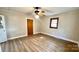 Spacious bedroom with wood laminate floors, light walls, and a ceiling fan at 16603 Nc Hwy 73 Hwy, Albemarle, NC 28001