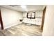 Traditional kitchen with white cabinets, laminate floors, and view into adjacent rooms at 16603 Nc Hwy 73 Hwy, Albemarle, NC 28001
