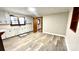 Traditional kitchen with white cabinets, laminate floors, and view into adjacent rooms at 16603 Nc Hwy 73 Hwy, Albemarle, NC 28001