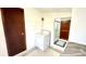 Functional laundry area equipped with a washer and a doorway to the bathroom at 16603 Nc Hwy 73 Hwy, Albemarle, NC 28001