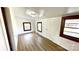 A bright, airy room featuring wood-look floors and windows with dark wood trim at 16603 Nc Hwy 73 Hwy, Albemarle, NC 28001