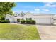 Beautiful white home with an attached garage and well-kept lawn at 1728 Privette Rd, Matthews, NC 28105