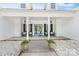 Inviting front porch with seating and a charming blue front door at 1728 Privette Rd, Matthews, NC 28105