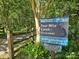 Image of Four Mile Creek Greenway sign, which provides walking access for your enjoyment at 1728 Privette Rd, Matthews, NC 28105