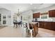 Bright kitchen with white subway tile backsplash, wooden cabinets, island, and stainless appliances at 1728 Privette Rd, Matthews, NC 28105