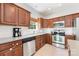 Well-equipped kitchen with stainless steel appliances, subway tile backsplash and wooden cabinets at 1728 Privette Rd, Matthews, NC 28105