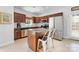 Stylish kitchen with island, stainless steel appliances, and classic wood cabinetry at 1728 Privette Rd, Matthews, NC 28105