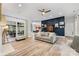 Open living space with a large window, modern flooring, and stylish decor at 1728 Privette Rd, Matthews, NC 28105