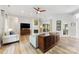 Spacious living room with a fireplace, TV, and wood-look flooring at 1728 Privette Rd, Matthews, NC 28105