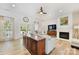 Inviting living room featuring a fireplace, wood floors, and natural light at 1728 Privette Rd, Matthews, NC 28105