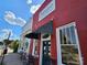 Charming exterior view of Sante Fine Dining Restaurant, with a classic awning, complemented by a red brick facade at 1728 Privette Rd, Matthews, NC 28105