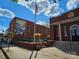 Street view of Matthews Station House, featuring an inviting outdoor patio and an adjacent historical mural at 1728 Privette Rd, Matthews, NC 28105