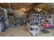 An unfinished basement with storage shelves, exposed ceiling, and concrete floor at 174 Perrin Dr, Mooresville, NC 28117