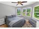 This bedroom has ample natural light, modern minimalist design, and carpet floors at 174 Perrin Dr, Mooresville, NC 28117