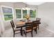 Bright and airy dining area with large windows, perfect for enjoying meals with a view of the outdoors at 174 Perrin Dr, Mooresville, NC 28117