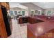 A well-lit kitchen with an adjacent dining nook, and a combination of dark and light colored features at 174 Perrin Dr, Mooresville, NC 28117