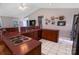 An eat-in kitchen with wood cabinets, mauve countertops, and stainless steel appliances at 174 Perrin Dr, Mooresville, NC 28117
