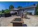 Outdoor patio area with a grill, patio table set, and a fire pit at 174 Perrin Dr, Mooresville, NC 28117