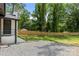 A spacious backyard with new fence and gravel parking at 1820 Shannonhouse Dr, Charlotte, NC 28215