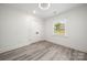Bright bedroom with closet, window, and ceiling fan at 1820 Shannonhouse Dr, Charlotte, NC 28215