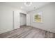 Bright bedroom with closet, window, and ceiling fan at 1820 Shannonhouse Dr, Charlotte, NC 28215