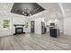 Open floor plan with living room and modern kitchen with a stylish blue island at 1820 Shannonhouse Dr, Charlotte, NC 28215