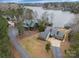 An aerial view of two homes features waterfront access, complemented by views of Lake Wylie at 192 Diana Dr, Mount Gilead, NC 27306