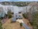 Aerial view of a waterfront home on a large lot with mature trees at 192 Diana Dr, Mount Gilead, NC 27306