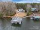Stunning lakefront property with a private boathouse and beautifully landscaped grounds at 192 Diana Dr, Mount Gilead, NC 27306