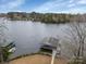 Aerial view of a private boat dock on a serene lake setting at 192 Diana Dr, Mount Gilead, NC 27306
