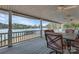 Covered porch with beautiful lake views, outdoor seating and ceiling fans for the summer at 192 Diana Dr, Mount Gilead, NC 27306