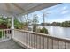 Balcony view overlooking a lake with lush trees at 192 Diana Dr, Mount Gilead, NC 27306