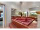 Unique bathroom with a mirrored wall and a large, red jetted tub for relaxation at 192 Diana Dr, Mount Gilead, NC 27306
