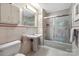 Traditional bathroom with a pedestal sink, enclosed tub shower, and white tile floor at 192 Diana Dr, Mount Gilead, NC 27306