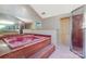 Bathroom with a large pink soaking tub, a large vanity mirror and a standup shower at 192 Diana Dr, Mount Gilead, NC 27306