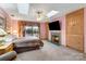 Large bedroom with a built-in fireplace and mounted TV at 192 Diana Dr, Mount Gilead, NC 27306