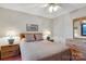 Cozy bedroom featuring a queen-size bed, nightstands, and a ceiling fan at 192 Diana Dr, Mount Gilead, NC 27306
