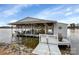 Covered boat dock with seating and docking for multiple boats offers waterfront living at 192 Diana Dr, Mount Gilead, NC 27306