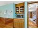 Cozy dining area with built-in wooden cabinets and display shelving at 192 Diana Dr, Mount Gilead, NC 27306