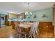 Dining room showcasing an island, hardwood floors, and lake views at 192 Diana Dr, Mount Gilead, NC 27306