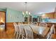 Traditional dining room with wood floors, chair railing, and a table with seating for six at 192 Diana Dr, Mount Gilead, NC 27306