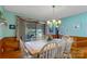 Dining room with hardwood floors, a large table, and views of the lake at 192 Diana Dr, Mount Gilead, NC 27306