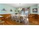 Light-filled dining room features a wooden table set with seating for eight and sliding glass doors at 192 Diana Dr, Mount Gilead, NC 27306
