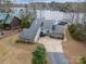 A waterfront property features a neutral facade, a blue door, and a boat dock on Lake Wylie at 192 Diana Dr, Mount Gilead, NC 27306