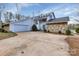 Well-maintained home featuring stone accents, a two-car garage, and manicured landscaping at 192 Diana Dr, Mount Gilead, NC 27306