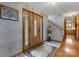 Foyer showcasing wood door with stained glass, staircase, and hardwood floors at 192 Diana Dr, Mount Gilead, NC 27306