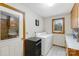 Practical laundry room features a washer, dryer, utility sink, and storage cabinets at 192 Diana Dr, Mount Gilead, NC 27306