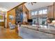 Spacious living room featuring stone fireplace, wood floors, and natural light at 192 Diana Dr, Mount Gilead, NC 27306